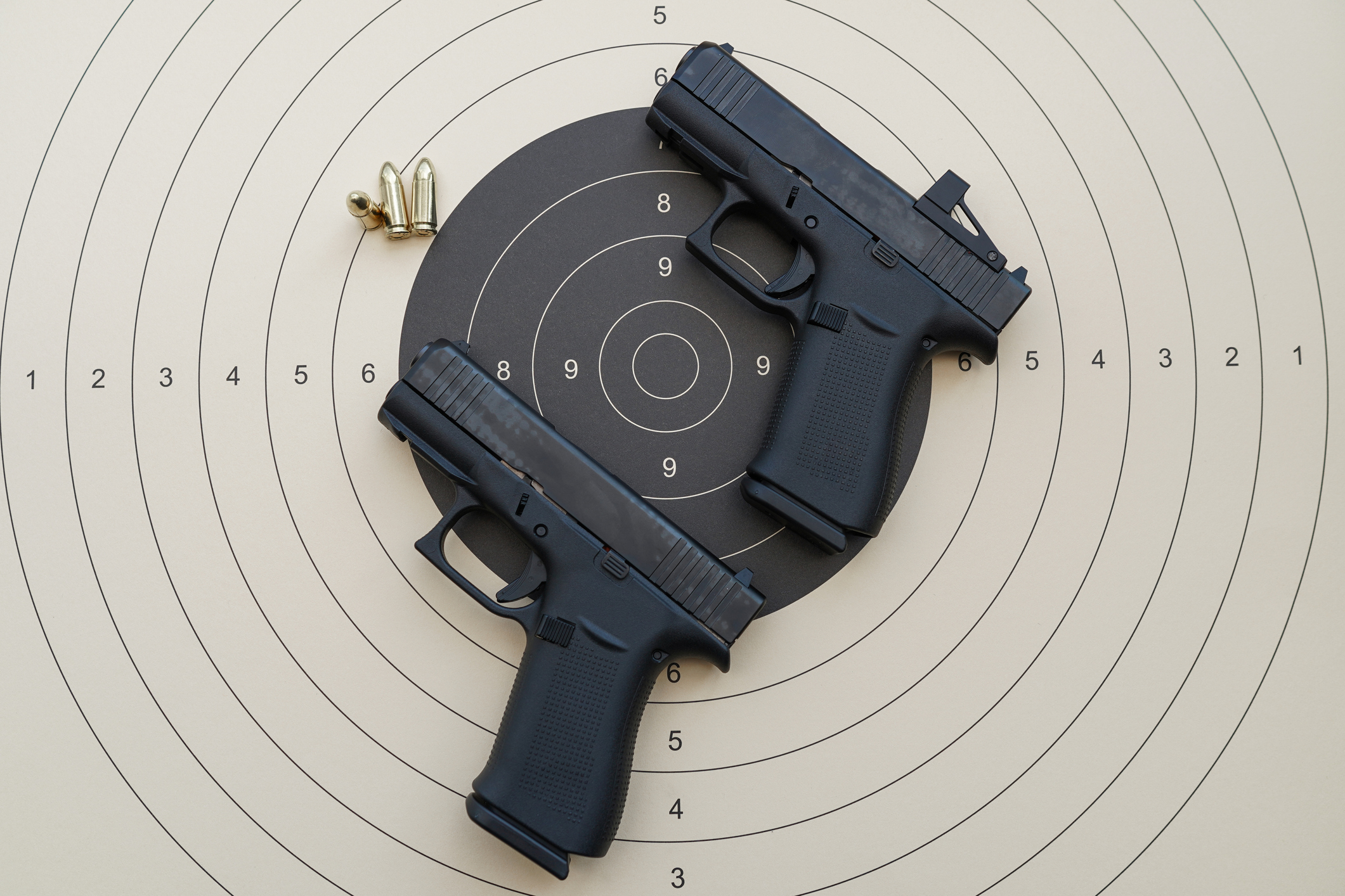 glock handguns on a paper target closeup